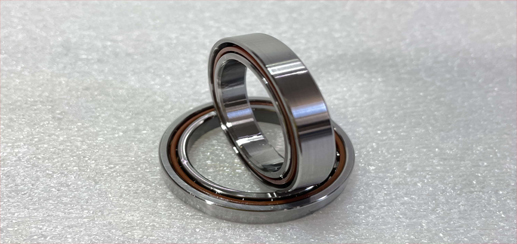 Why are angular contact bearings usually used in pairs?